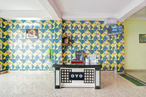 a room with colorful tiles on the walls at Hotel O Gulabi Delight in Faridabad +21 photos