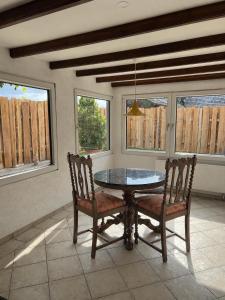 a dining room with a glass table and two chairs at Landliebe Wemb in Weeze +5 photos