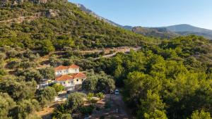 an aerial view of a house on a mountain at Jimmy Anna Apartments in Votsalákia +35 photos
