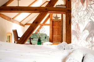 a bedroom with a bed with towels on it at Wronki- mazurski spokój in Wronki