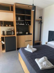 a bedroom with a bed with two towels on it at Fra Rooms in Taormina