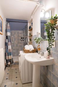 a bathroom with a sink and a shower at La Soleillade in Manosque