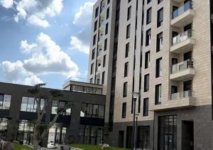 a largeartment building with a building at SL Apartment in Tirana +2 photos