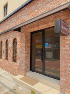 a brick building with a entrance to a store at 무무 mumu in Seoul