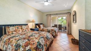 a bedroom with two beds and a balcony at Las Mañanitas LM C208 in San José del Cabo +22 photos