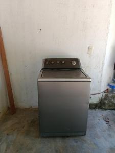 a stove sitting in a room with a wall at Casa campo Villa Yaneth in Pueblo Bello +10 photos