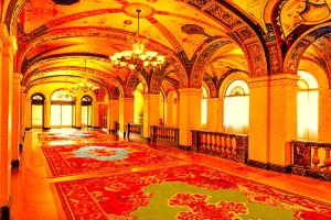 a large room with a large rug on the floor at Hotel Bhanuka Palace in Dhanbād