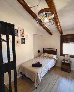a bedroom with a bed and a ceiling at El Mirador de Mesones in Mesones de Isuela +35 photos