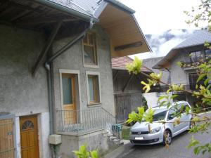 a car parked in front of a house at Weaky what you want in Ugine