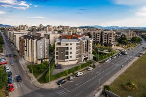 an aerial view of a city with buildings at Perla Residence Hotel & SPA in Podgorica