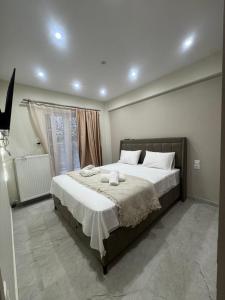 a bedroom with a bed with two towels on it at Pramanta Nest in Pramanta