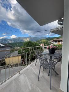 a patio with a table and chairs on a balcony at Pramanta Nest in Pramanta