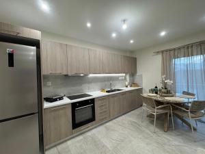 a kitchen with a table and a stove top oven at Pramanta Nest in Pramanta