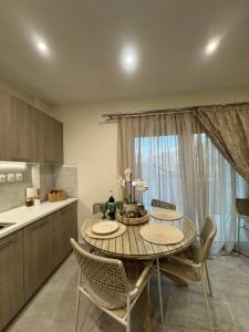 a kitchen with a table and chairs in a kitchen at Pramanta Nest in Pramanta