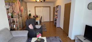 a living room with a couch and a table at Ferienwohnung FeLuMi in Wadgassen