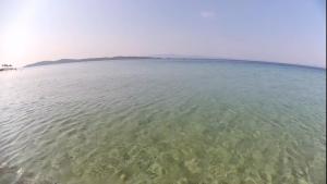 a large body of water with an island in the distance at Casa Patronimio Aristotle Socrates Residence in Ierissos