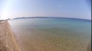 a view of a beach with people in the water at Casa Patronimio Aristotle Socrates Residence in Ierissos
