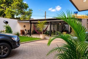 a car parked in front of a house at Vila inn hotel in Brasília