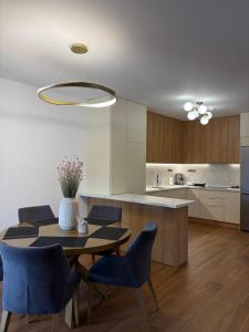 a kitchen and dining room with a table and chairs at Diktamo Village House in Ofrínion