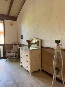 a dressing room with a dresser and a mirror at Pousada Engenho da Lagoa in Garopaba