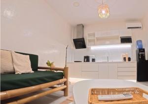 a living room with a couch and a table at The Retreat in Panglao Island