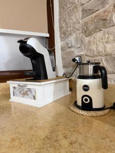 a coffee maker sitting on top of a counter at Casa La Grotta in Bitonto