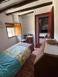 a bedroom with a large bed and a mirror at Cal Rabell in Bellmunt +33 photos