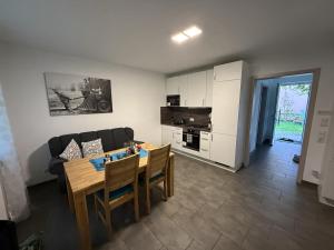 a living room with a table and a couch at Ferienwohnung26 in Blankenfelde