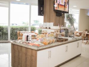 a kitchen with a counter with food on it at Swan Rio Grande in Rio Grande +21 photos