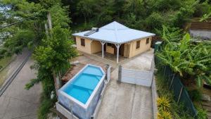an overhead view of a house with a swimming pool at Villa Tidodo in Les Anses-dʼArlets