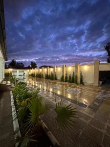 a building with a courtyard with plants and lights at Villa in Baku