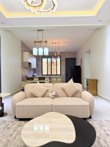 a living room with a couch and a table at Zabibu Residence in Nkongontha
