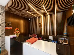 an office with a desk with a book on it at SEA BEACH HOTEL Near Swargadwar-Golden Beach- Jagannath Temple - PARK , Fully Air Conditioned Rooms ,Wifi , Lift , And Free Parking , BEST HOTEL IN PURI in Puri +12 photos