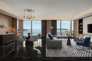 a living room with a view of the ocean at Sheraton Kota Kinabalu in Kota Kinabalu