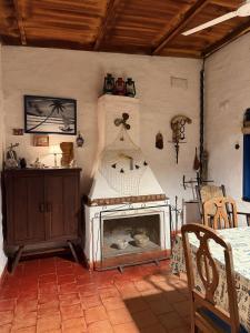 a living room with a fireplace in a room at CASA JUNTO AL RIO in Paraná