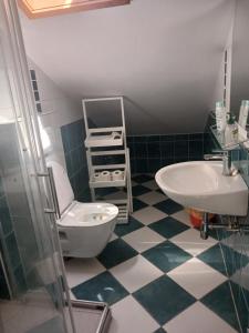 a bathroom with a sink and a toilet and a tub at Apartments Maja in Hvar +51 photos
