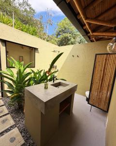 a bathroom with a concrete sink on a patio at Selva Serena in Anapoima