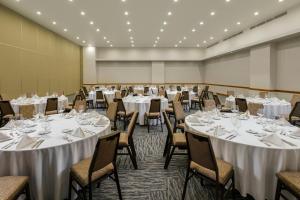 a banquet room with tables and chairs with white linens at The Westin Los Cabos Resort Villas in San José del Cabo +119 photos