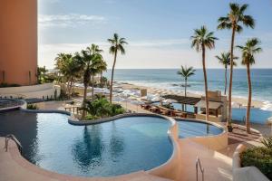 a resort pool with a view of the beach at The Westin Los Cabos Resort Villas in San José del Cabo