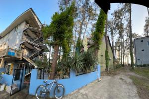 a bike parked in front of a building at hotel shomari in Grigoleti