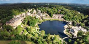 an aerial view of a resort on a lake at Le clos Ghisline in Madré