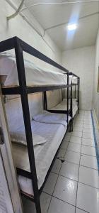 a bunk bed room with two bunk beds in it at Shinam hostel 777 in Chilanzar +14 photos