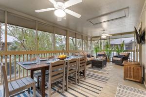 a dining room with a table and a couch at 1128 Summerwind Cottage in Seabrook Island