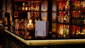 a bar with a lot of bottles of alcohol at Boutique Hotel Soyka in Špindlerův Mlýn