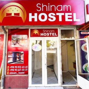 a fast food restaurant with a sign on the front of it at Shinam hostel 777 in Chilanzar