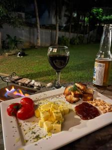 a plate of food on a table with a glass of wine at Areal in Areal +11 photos