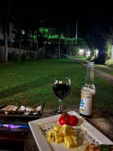 a plate of food and a bottle of wine and a glass at Areal in Areal