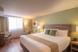 מיטה או מיטות בחדר ב-Stanza Hotel +59 תמונות