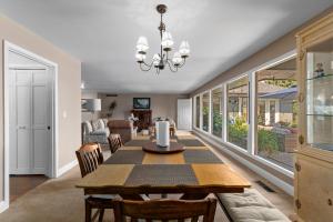 a dining room and living room with a table and chairs at Baskets, Brews & Views: Epic Wenatchee Escape! in Wenatchee