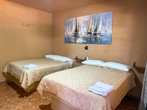 Postel nebo postele na pokoji v ubytování Hotel Marena